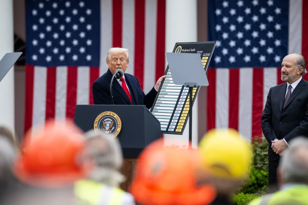 President Donald Trump displays a chart of reciprocal tariff rates at the White House in April 2025.