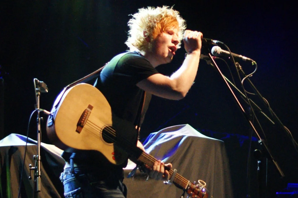 Ed Sheeran performs with an acoustic guitar at Academy 1 in Manchester. Photo: Phil King/Man Alive!, CC BY 2.0.