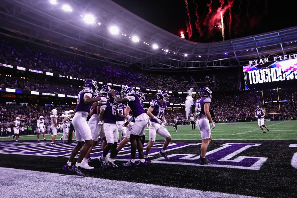 Northwestern players celebrate during the Wildcats' 34-13 win over Penn State in the 2026 Ryan Field opener.